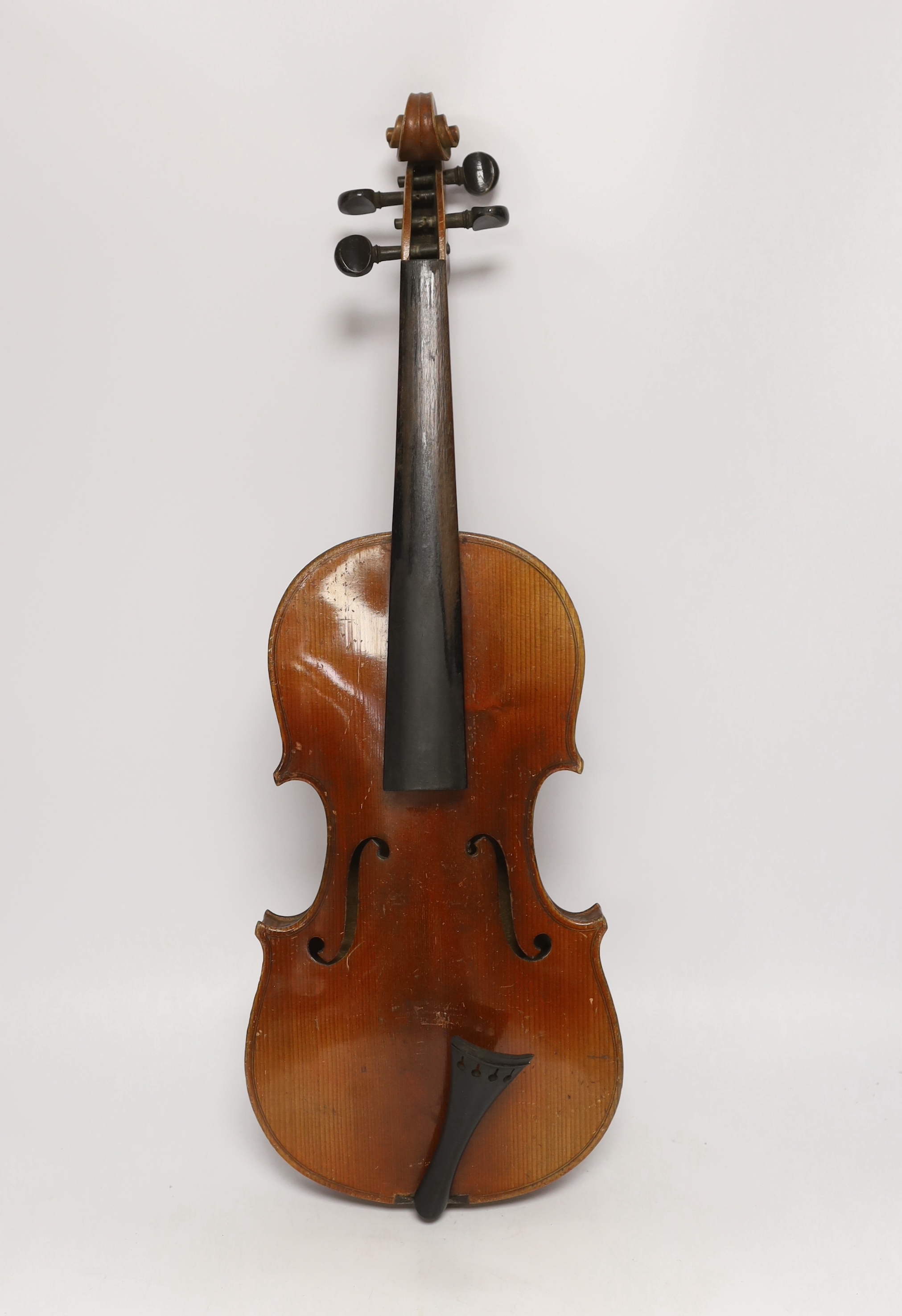 An early twentieth century violin for restoration in an ebonised wooden case, body 36cm (without bow)